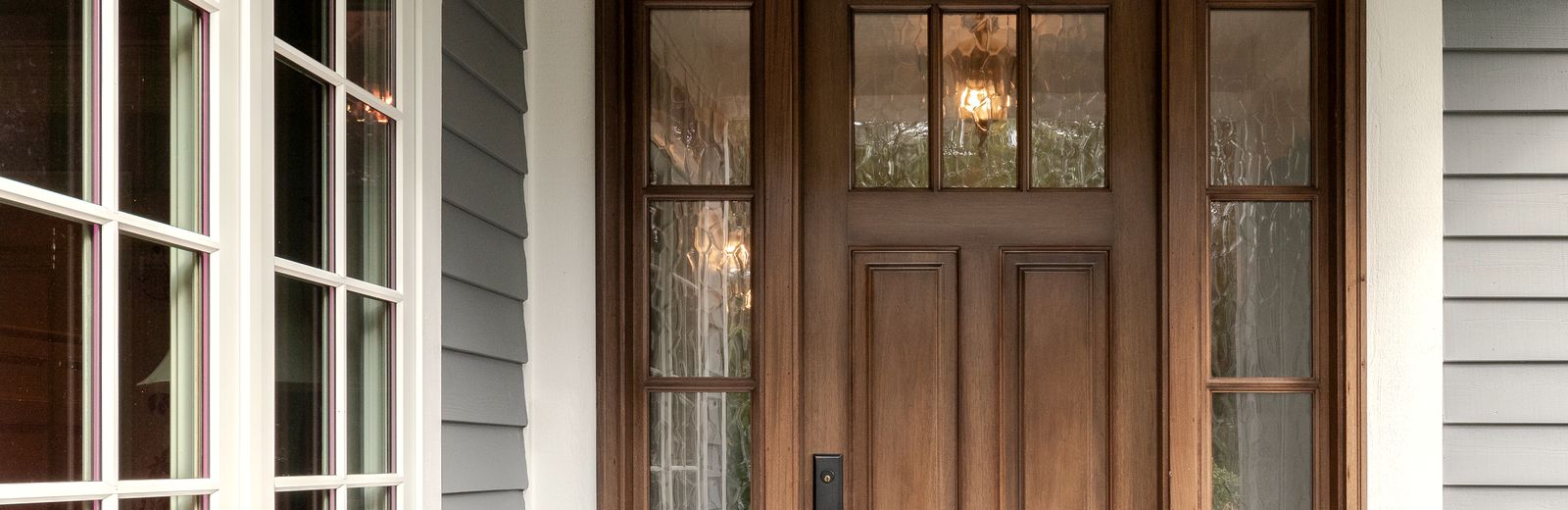 The front door and porch of a family home